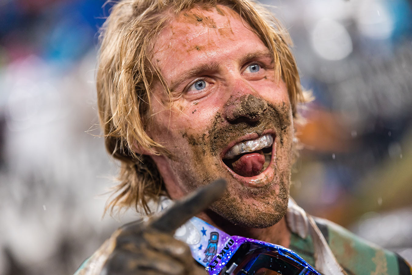 Justin Barcia celebrating his win with mud on his face at the East Rutherford AMA Supercross event