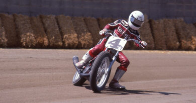 Chris Carr drifting through a turn during a flat track race